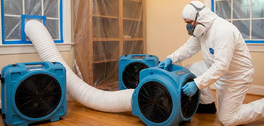 HEPA air scrubber running in a commercial room during smoke odor cleanup.